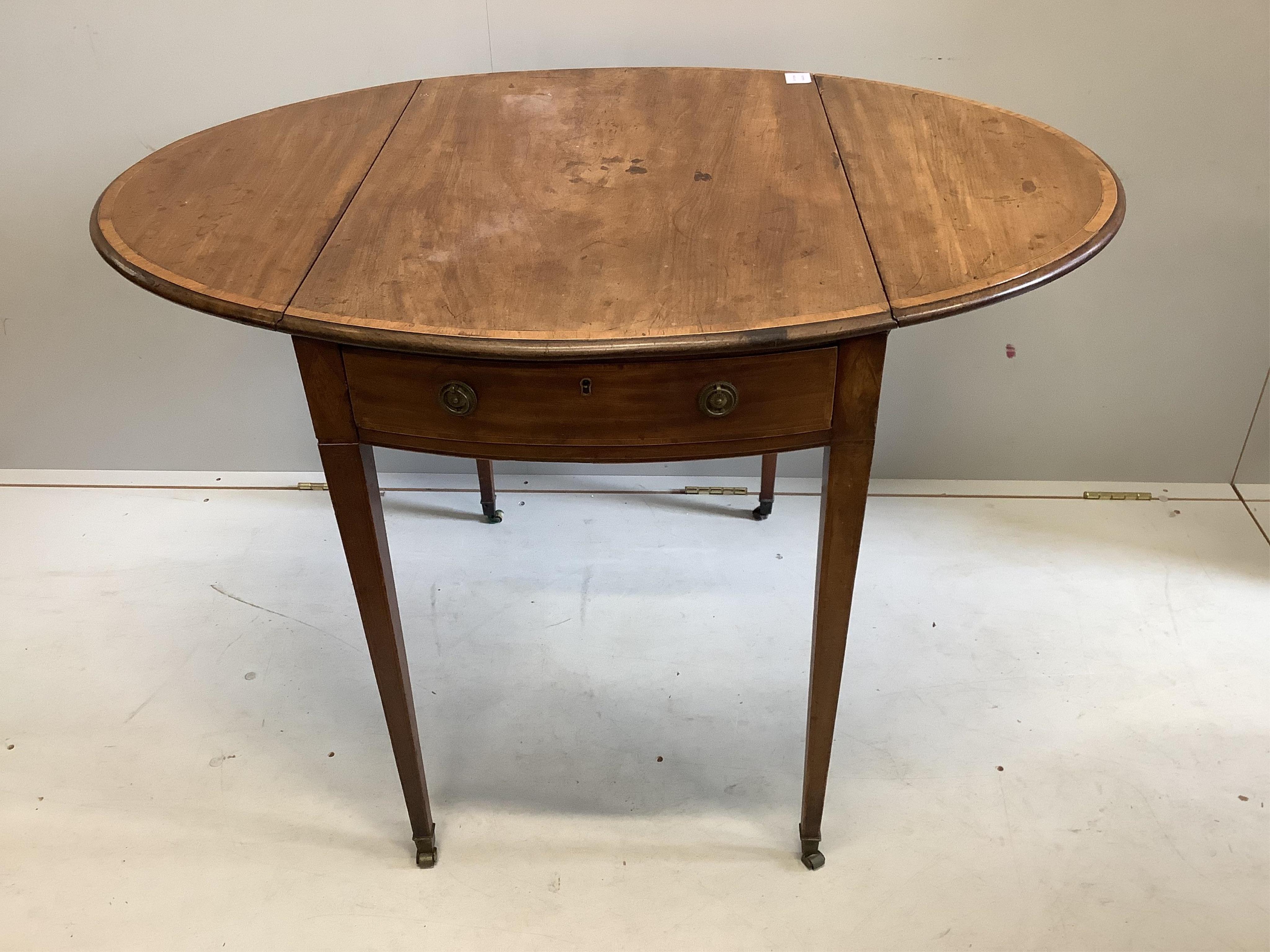 A George III mahogany and tulipwood banded oval topped Pembroke table, width 78cm, depth 53cm, height 73cm. Condition - poor